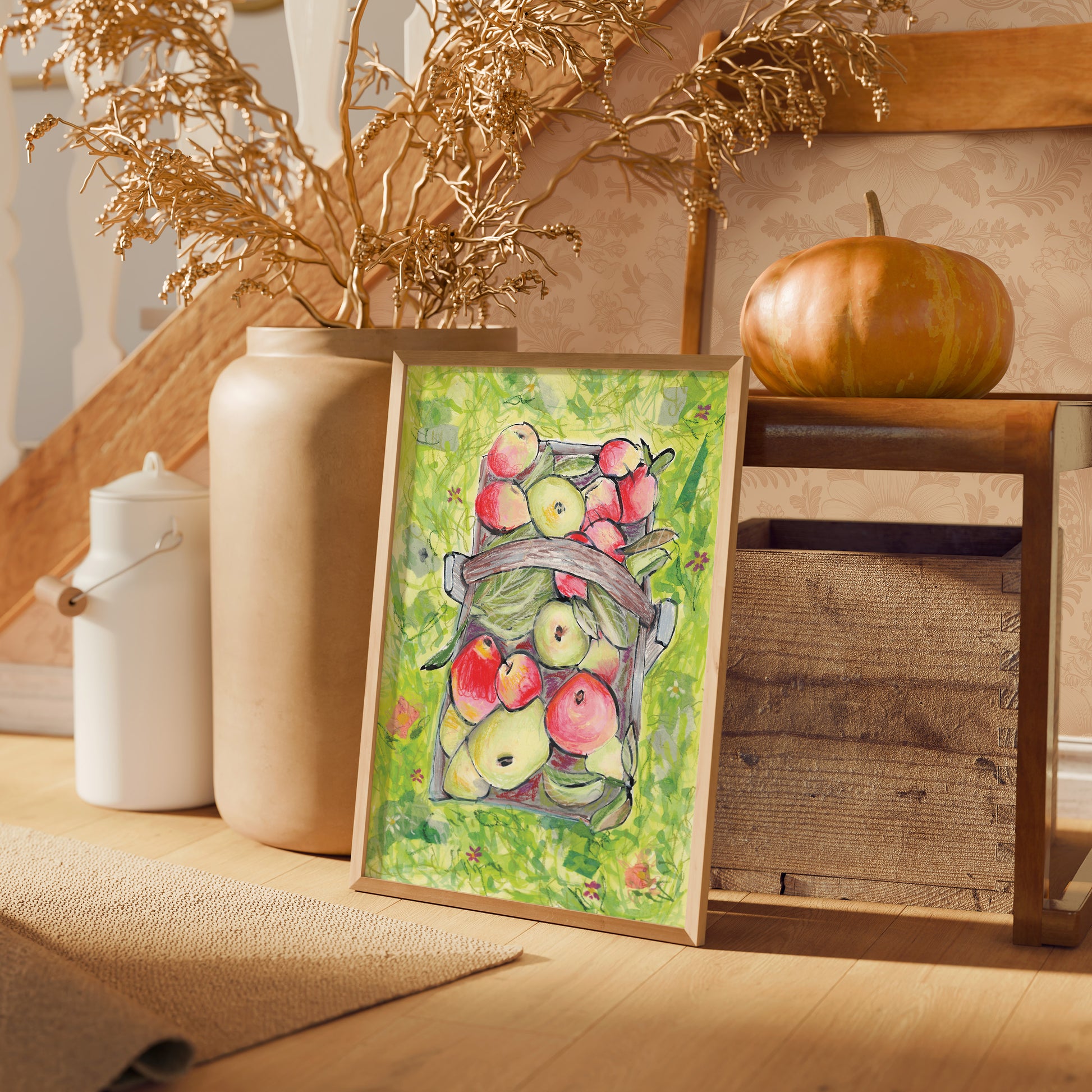 Framed artwork of apples on a table with autumnal decorative elements