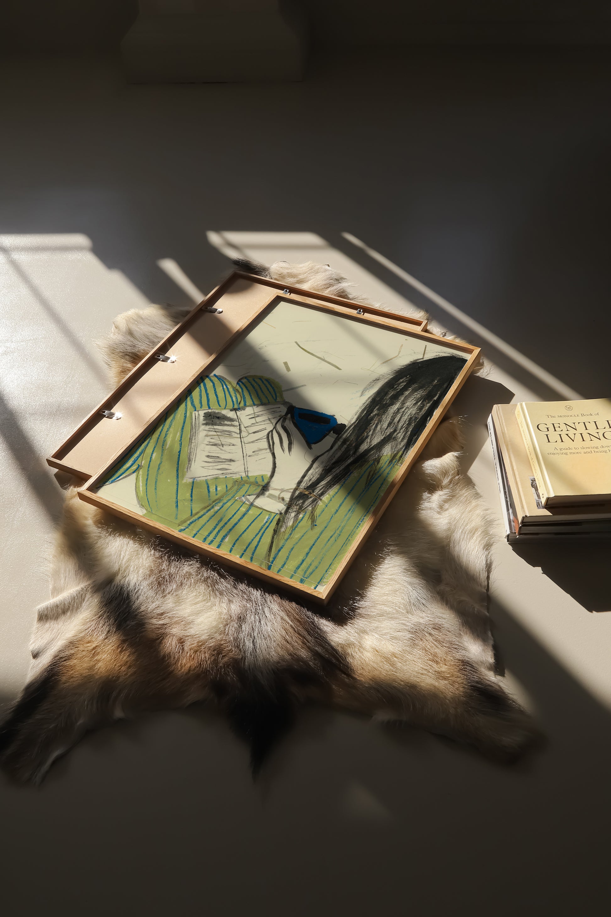 Illustration of a girl wearing a striped pyjama, reading a book and drinking out of a blue mug.