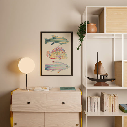 Room interior with a dresser, lamp, and wall art featuring fish.