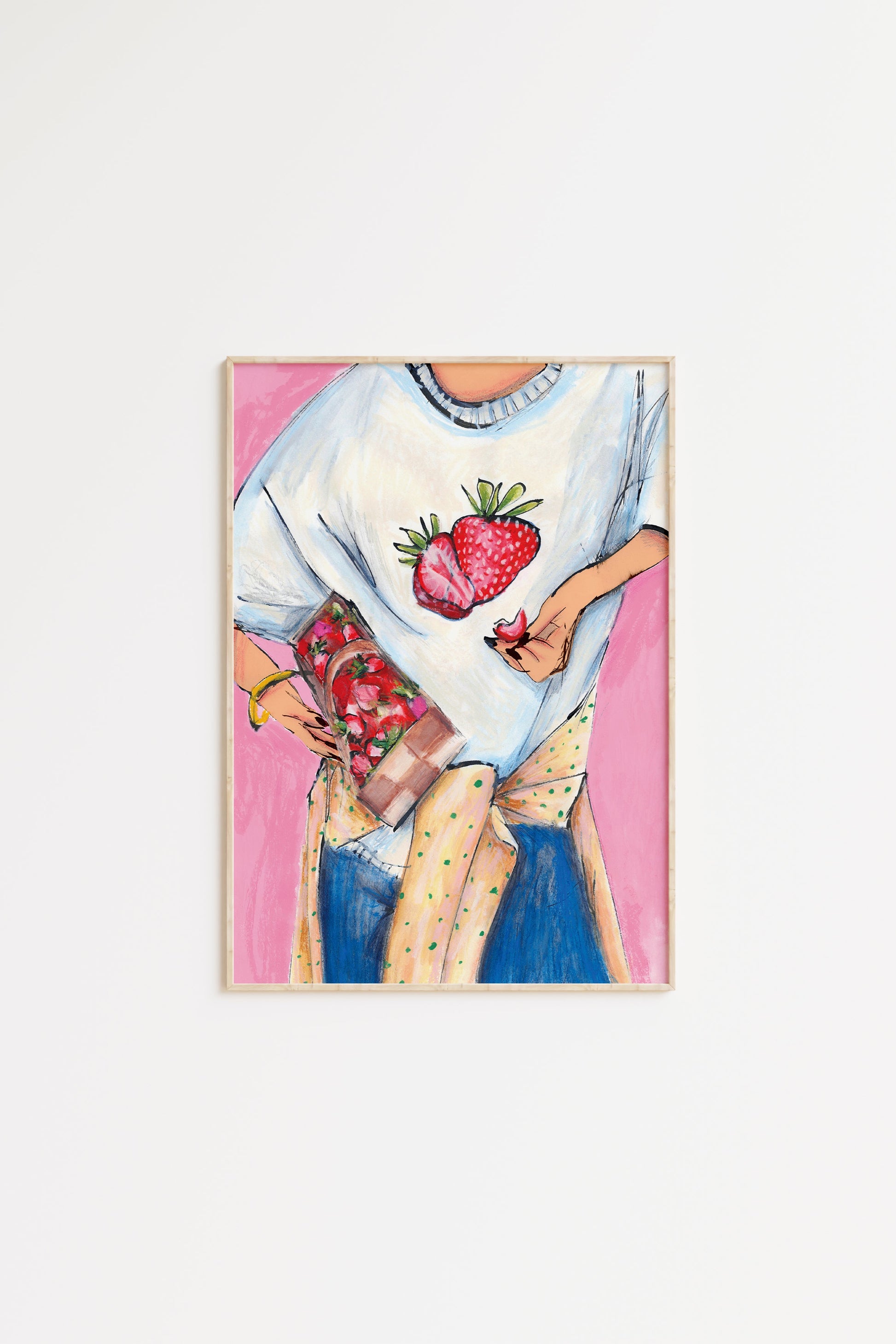 Framed artwork of a person holding strawberries on a white background