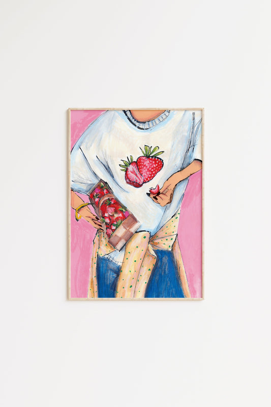 Framed artwork of a person holding strawberries on a white background